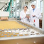 Two Workers Overseeing Food Production